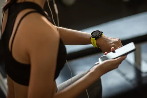 Smartwatch displaying heart rate zones and GPS route during outdoor run