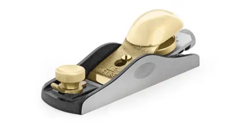 Lie-Nielsen No. 60-1/2 low-angle block plane on a woodworking bench showing precision sole