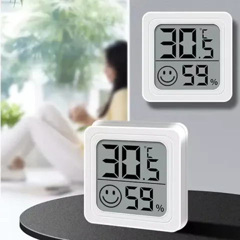Indoor digital thermometer hygrometer home weather station with LCD showing temperature and humidity reading