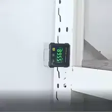 Magnetic digital angle box level with dual laser system and 4-side display on a construction surface