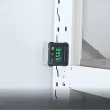 Magnetic digital angle box level with dual laser system and 4-side display on a construction surface