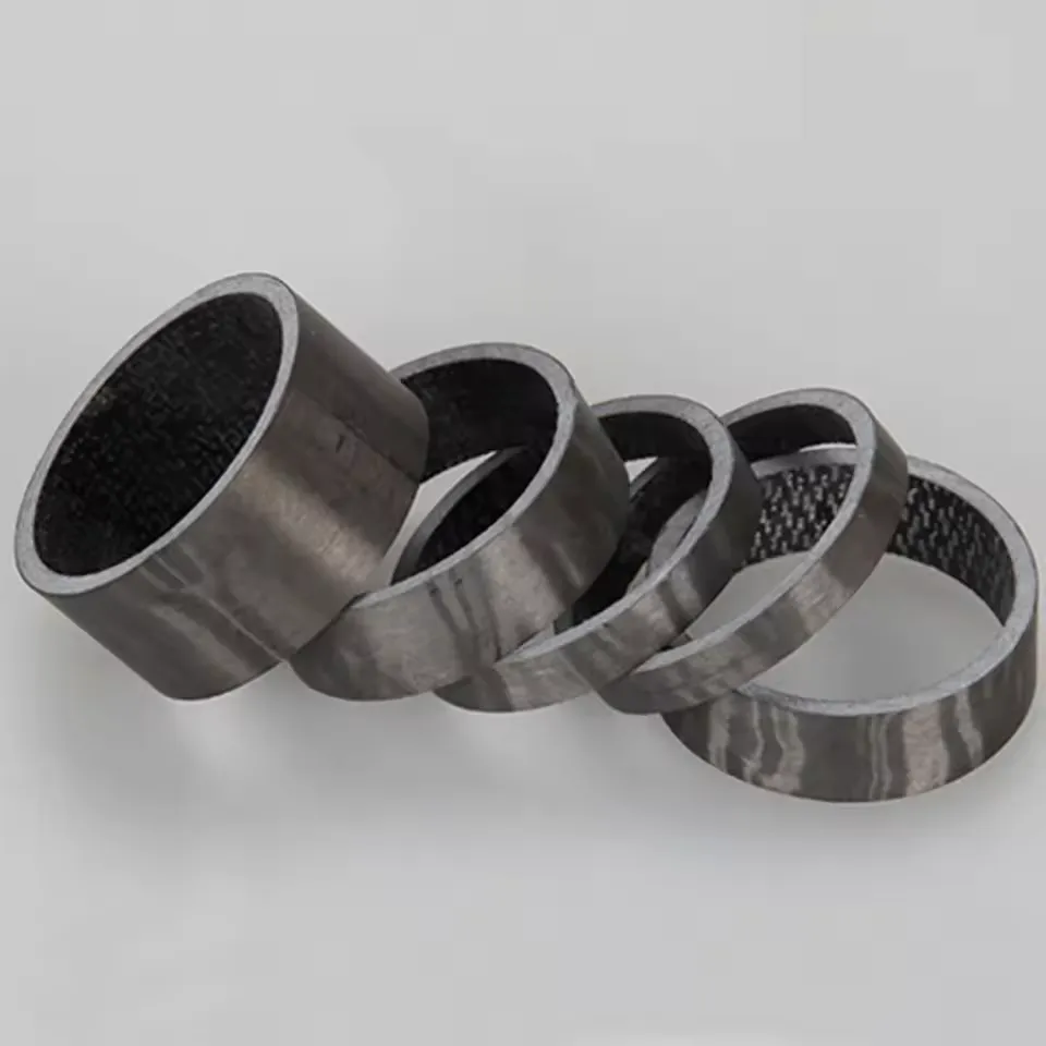 Carbon stem spacer set showing multiple spacer heights for stack adjustment and riding position tuning
